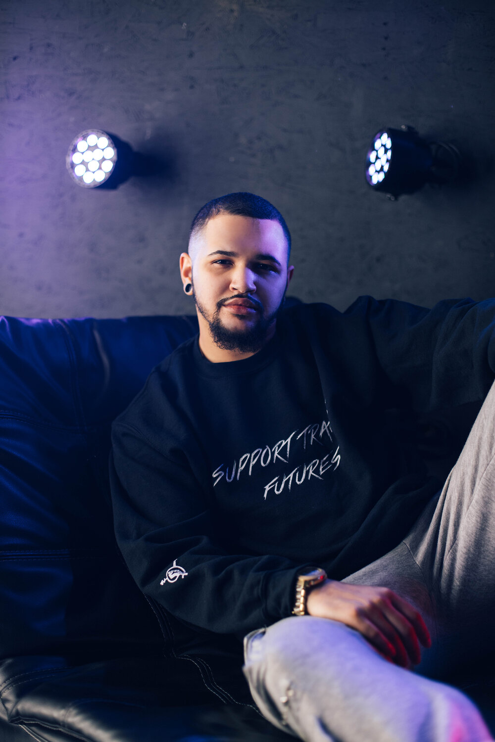 Modeling a “Support Trans Futures” sweatshirt from the gc2b’s  “Safe Travels” Capsule Collection